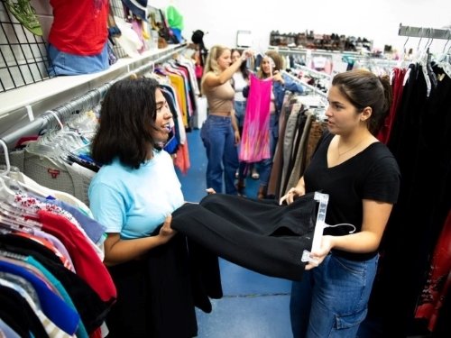 Students shopping at Saints Share Wear