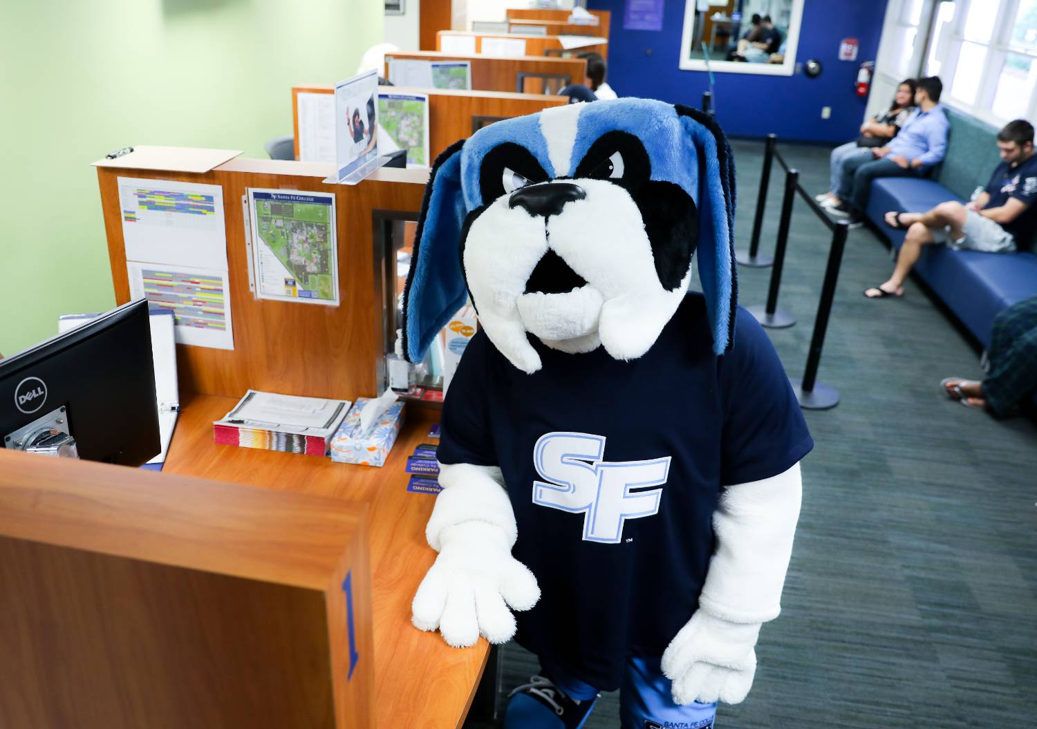 Mascot stands at financial aid desk