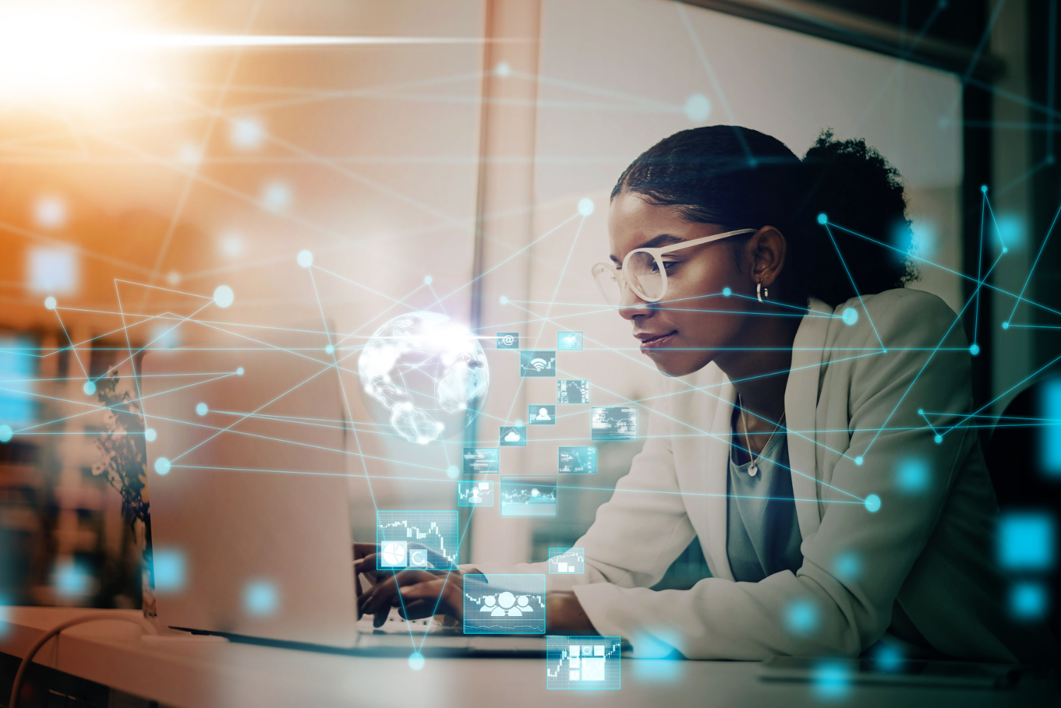 Women looks at computer, Image is overlayed with technology graphics.