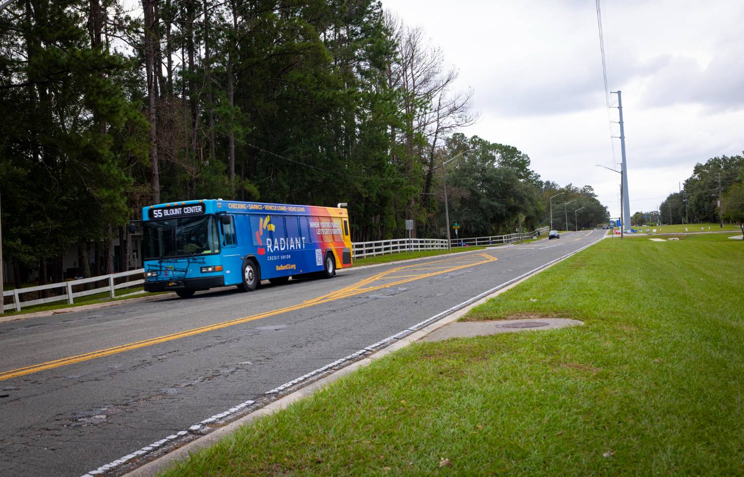 A city bus travels along 83rd street