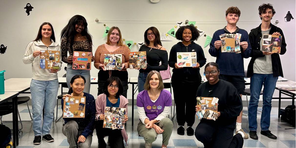 group of students holding vision boards